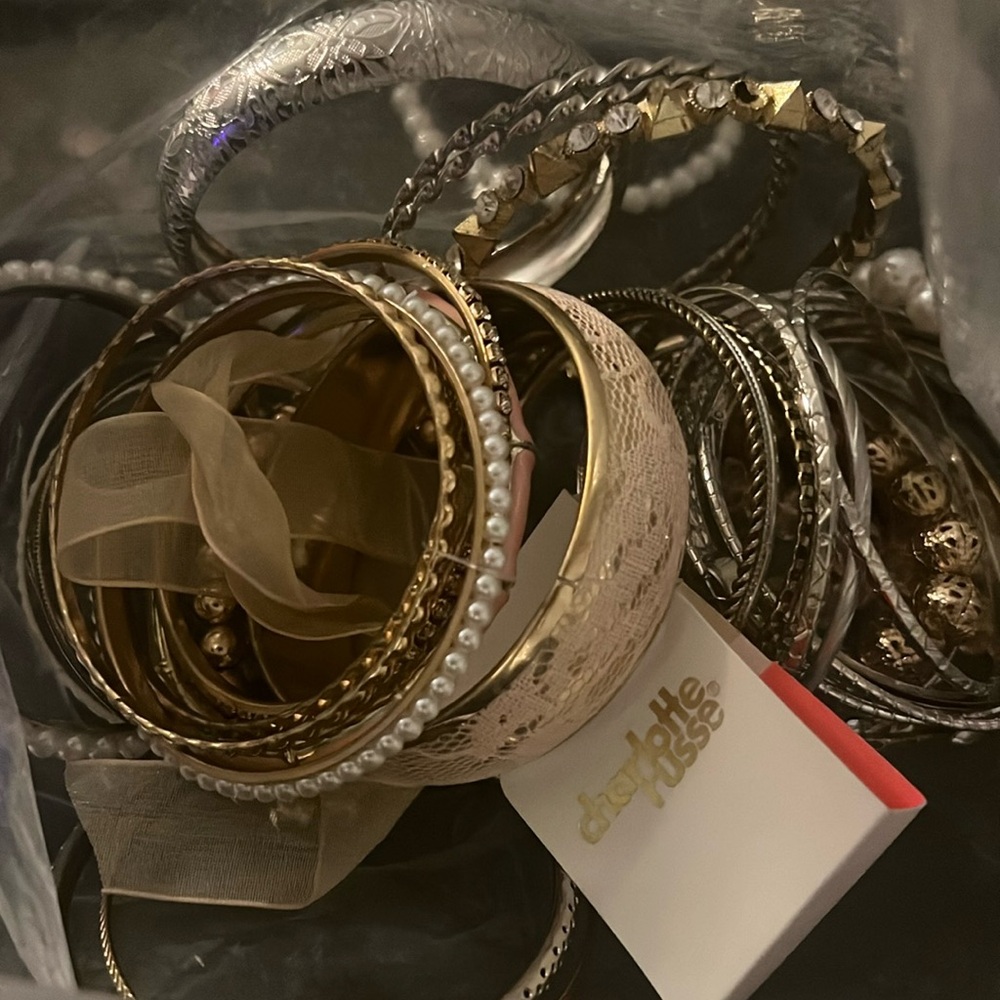 A big ziplock bag full of Charlotte Russe bangles